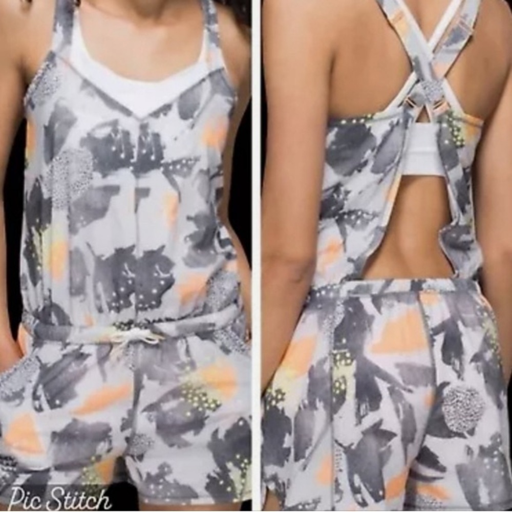 NWOT Lululemon Be Free Runsie Mini‎ Art Pop romper in white multi-color.